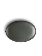 Top view of the Grant ottoman 90x64 by Poltrona Frau highlighting the smooth upholstered surface and oval silhouette