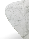 Close-up of the rounded edge of the table top showing the soft elliptical form and smooth finish