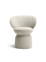 Small armchair with a softly contoured seat and supportive backrest, presented in a clean studio setting to showcase its form and structure