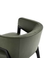 Rear detail of the DUO lounge armchair by Poltrona Frau highlighting the curved backrest and open frame design