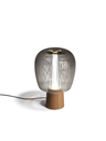 Standalone Nymph table lamp with a rounded upper form and compact base, emphasising its sculptural design