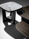 Baldwin modular small table by Poltrona Frau shown in close detail highlighting the marble top, sculptural base and refined material contrast.