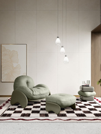 Squash rug by Poltrona Frau shown in a styled setting with seating, emphasising its presence within a curated interior environment
