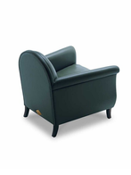 Rear view of the Lyra armchair by Poltrona Frau highlighting its rounded backrest and clean lines
