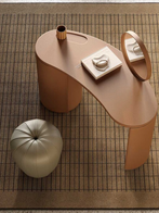 Stock N Roll dressing table by Poltrona Frau shown from above with tabletop accessories highlighting its curved form and refined dressing table function.
