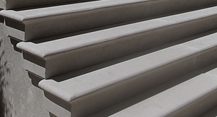 Close-up of custom precast concrete stair treads with smooth bullnose edges and uniform risers