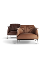 Two Archibald Large armchairs by Poltrona Frau displayed together showcasing proportions and design consistency