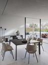 Homey table placed in a dining setting with chairs, showing the rectangular surface used for shared dining and everyday use