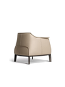 Side profile of the Archibald armchair by Poltrona Frau emphasizing its enveloping seat and proportions