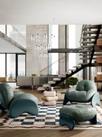Squash rug displayed in an open interior with seating, emphasizing the geometric pattern and its integration within the space