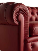 Close-up of the Chester One sofa by Poltrona Frau showing the rolled armrest with detailed pleating and craftsmanship