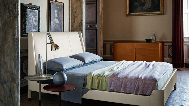 Poltrona Frau Fidelio Notte chest of drawers designed by Roberto Lazzeroni styled within an elegant bedroom interior beside a designer bed