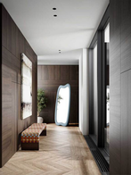 Brera 90th Anniversary bench by Poltrona Frau styled within a refined corridor setting with mirror and architectural elements