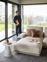 Close-up of the Blisscape sofa by Poltrona Frau showing the soft seat cushions and textured upholstery