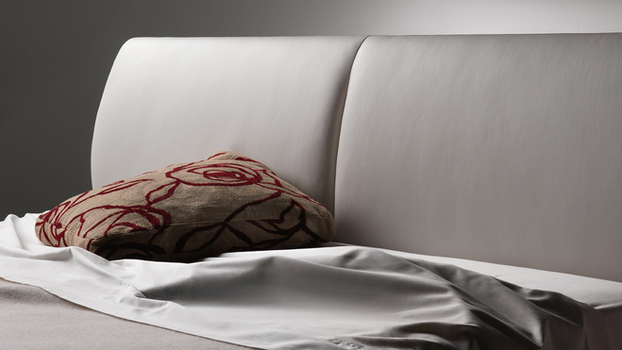 Poltrona Frau Eosonno bed headboard detail designed by Jean-Marie Massaud highlighting the soft upholstered headboard form