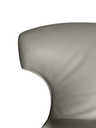 Side profile of the Montera Mas stool by Poltrona Frau showing the flowing lines of the seat and backrest