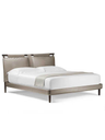 Side view of the Times bed showing the profile of the headboard and slender base structure