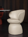 Small armchair presented individually with a smooth rounded backrest and compact base, highlighting its sculptural and balanced form