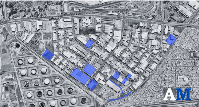 Site plan of factory precinct indicating workshop bays, loading aprons, storage rows, and precast panel logistics flow.