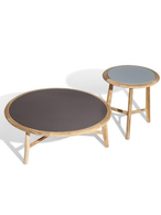 The Secret Garden small table shown with a round top and low profile base, emphasizing its compact proportions