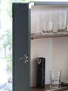 Close-up of internal shelving displaying glassware and storage compartments designed for organising drinks accessories