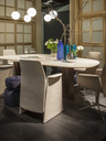 Jane table styled in a dining environment with seating and objects, illustrating its use as a central gathering table