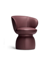 Compact armchair with a distinctive rounded base and enveloping seat, presented as a sculptural object suitable for refined interior settings