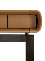 Rear view of the Peek-a-Book desk by Poltrona Frau showing the enclosed storage section and clean back profile