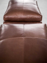 Detailed view of the Massimosistema sofa by Poltrona Frau highlighting the backrest cushion and soft padding