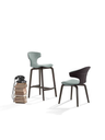 Montera stool by Poltrona Frau displayed alongside complementary seating pieces highlighting design cohesion and versatility