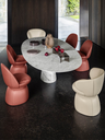 Mesa Ellipse table placed in a dining setting with seating, showing the elongated surface used for shared dining and gathering