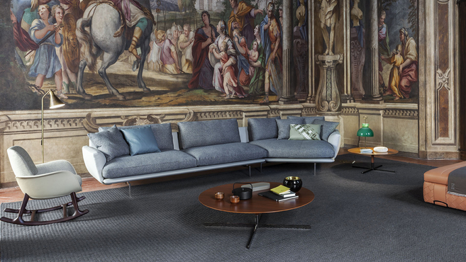 Get Back sofa by Poltrona Frau designed by Ludovica Serafini and Roberto Palomba styled within an architectural interior highlighting the curved modular seating form