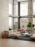 Happy Jack sofa by Poltrona Frau styled in a refined living room with tables and accessories, showing its integration into a modern interior