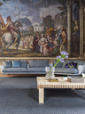 Pecan rug by Poltrona Frau placed in a living space beneath a sofa and table, highlighting its subtle texture and integration into a refined interior