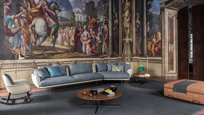 Poltrona Frau Bob coffee table styled within a refined living room setting demonstrating the elegant pedestal lounge table design