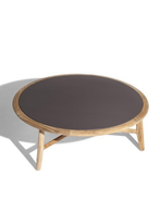 Round small table from The Secret Garden collection displayed with a structured base and smooth top surface