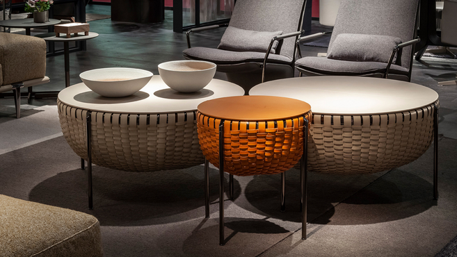 C’est La Vie coffee table by Poltrona Frau designed by GamFratesi displayed in a lounge setting highlighting the woven structure and sculptural table design