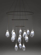 Hanging glass elements suspended from a circular frame, highlighting the arrangement and spacing of the chandelier components