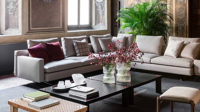 Rips Vase by Poltrona Frau from the Gli Oggetti accessories collection displayed on a coffee table with floral arrangement highlighting the decorative designer vase