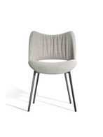 Standalone armchair highlighting variation in upholstery while maintaining the same sculptural backrest and compact structure