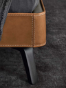 Detail of the Mamy Blue bed base highlighting the tapered leg and stitched upholstery