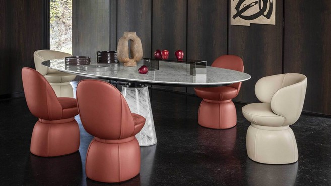 Leplì Small Armchair by Poltrona Frau designed by Kensaku Oshiro from the Leplì collection styled around a dining table highlighting the sculptural upholstered armchair for contemporary interiors