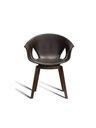 Front-facing studio view of the Ginger Ale chair showing the rounded seat, integrated armrests, and wooden legs