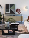 Shiwa vase by Poltrona Frau shown in a living room setting highlighting sculptural styling and refined interior decoration.
