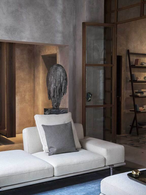 Let It Be sofa by Poltrona Frau shown in a lounge setting with surrounding decor, emphasising its role as a central seating element