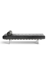 Clayton sofa by Poltrona Frau shown in an extended configuration resembling a daybed with cushion and bolster