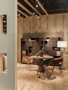 Ginger Ale chairs arranged around a meeting table in a contemporary workspace, demonstrating their use in a collaborative environment