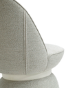 Close-up of the Leplì ottoman showing the texture and stitching of the upholstery along the curved surface