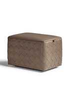 Grant ottoman 65x45 by Poltrona Frau displayed in a lighter finish highlighting the quilted leather pattern and compact design