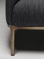 Close-up of the base and leg structure of the Archibald Denim Edition armchair by Poltrona Frau
